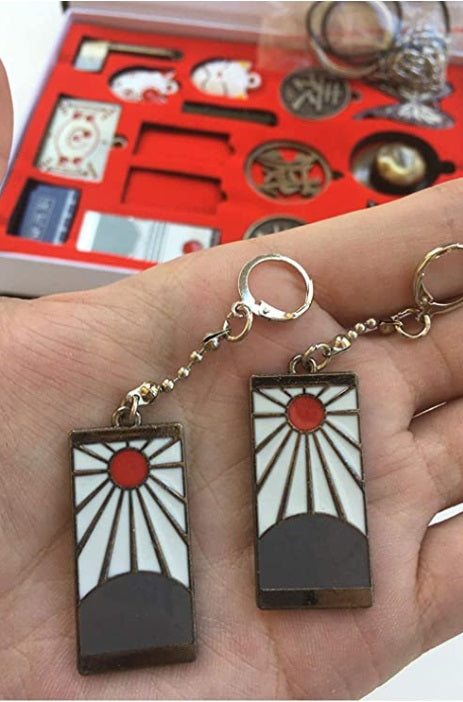 Demon Slayer - Kimetsu no Yaiba box collection of pendants and earrings مجموعة ميداليات وقلادات قاتل الشياطين.